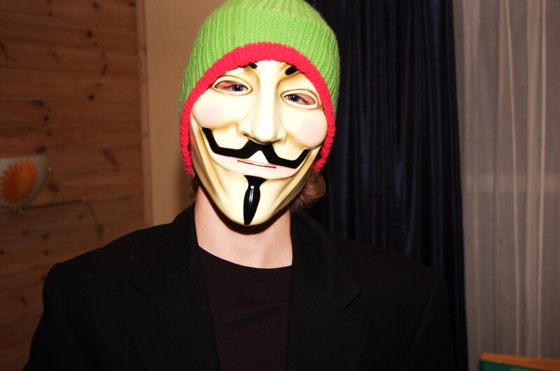 person wearing guy fawkes mask
