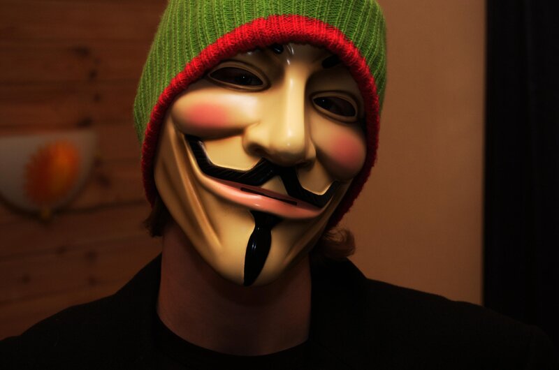 person wearing guy fawkes mask