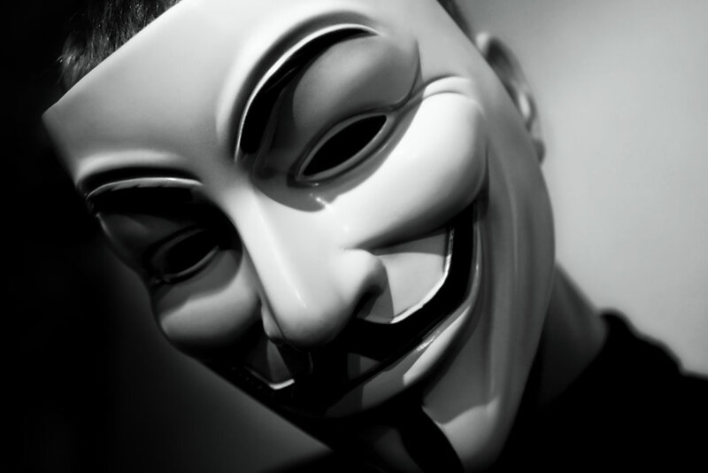 person wearing guy fawkes mask