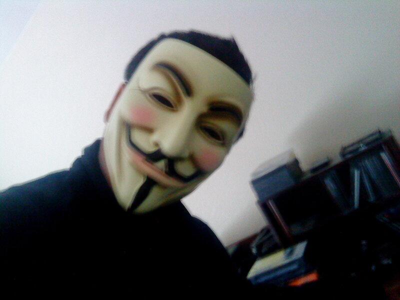 person wearing guy fawkes mask
