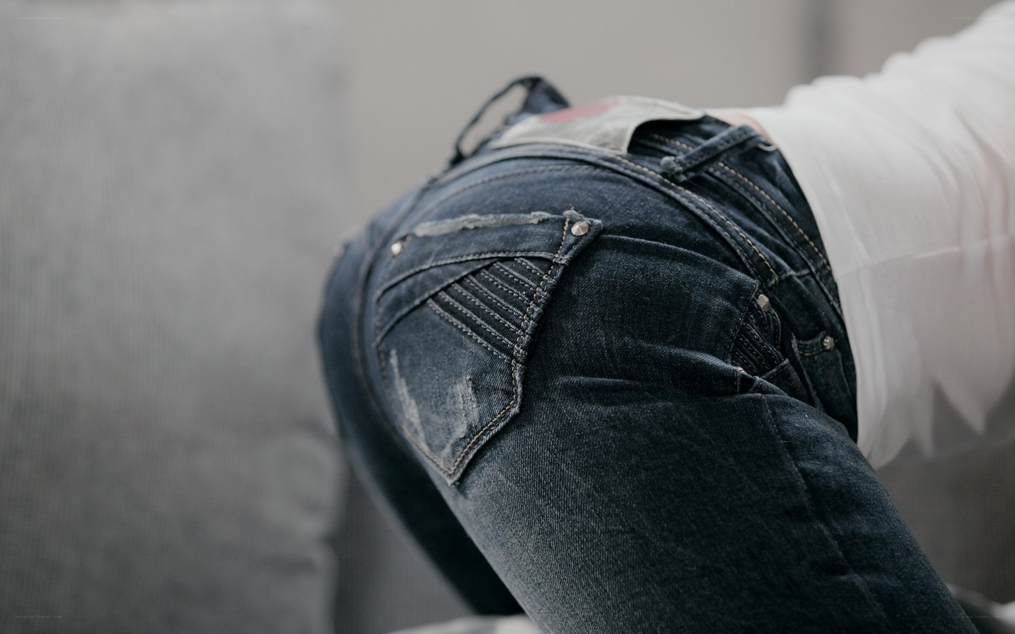 person wearing jeans from behind