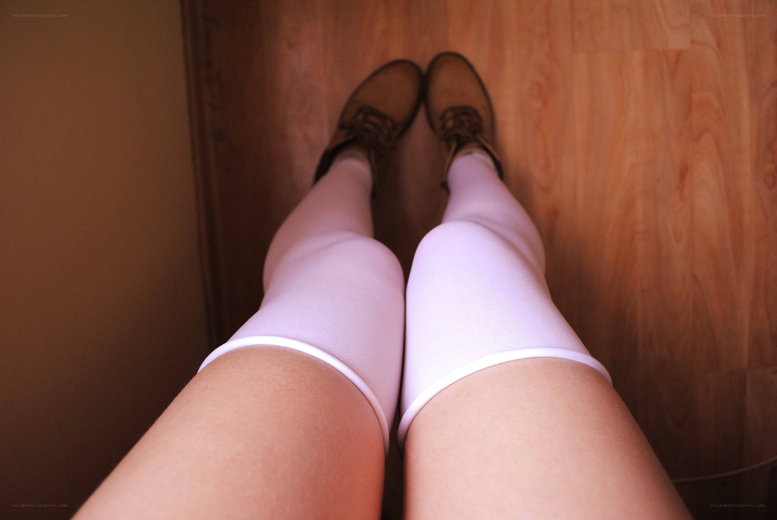person wearing knee-high socks