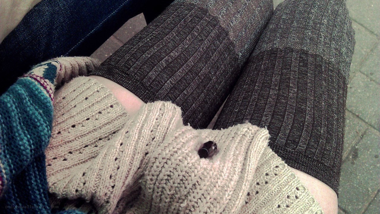 person wearing knitted sweater