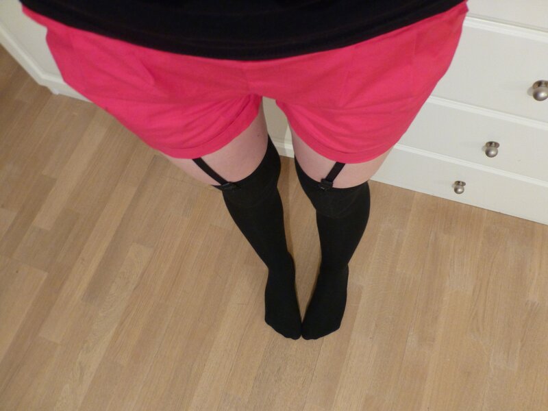 person wearing pink shorts and black stockings