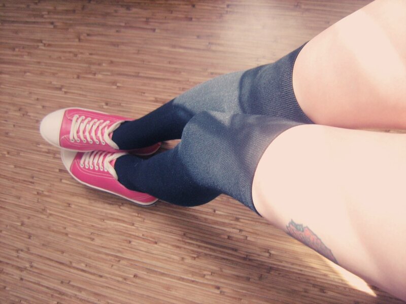 person wearing pink sneakers