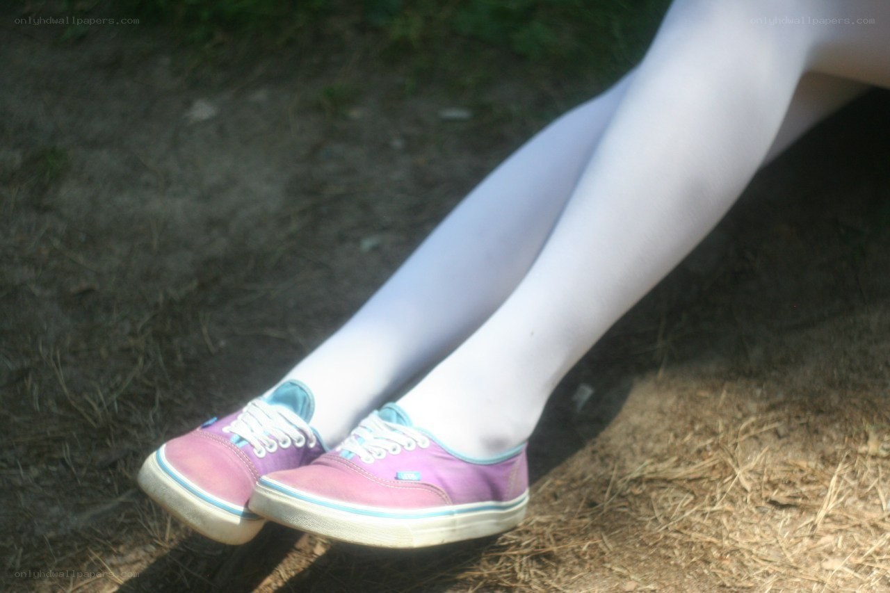 person wearing purple sneakers