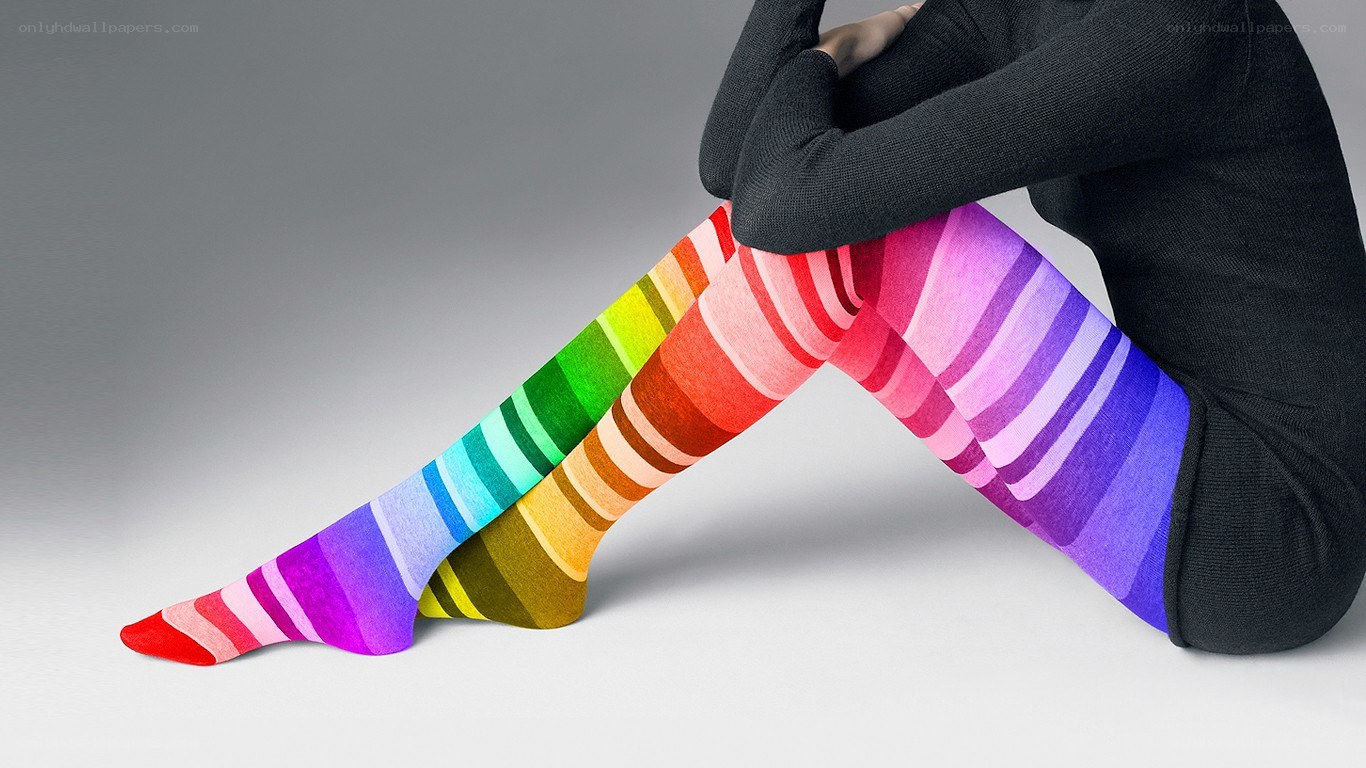 person wearing rainbow striped tights