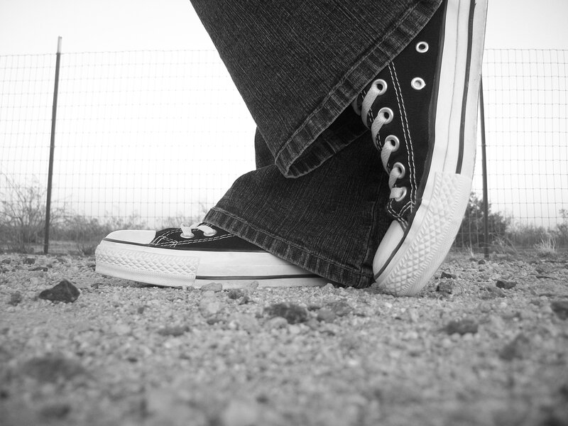 Person Wearing Sneakers — Black