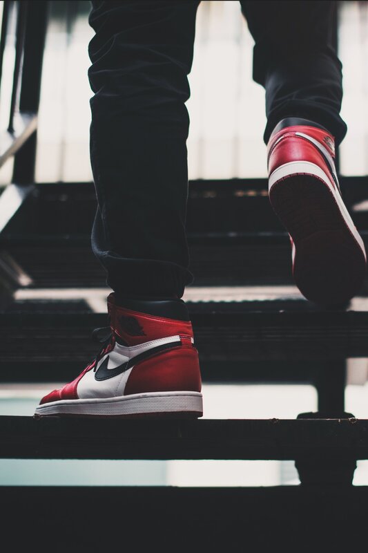 Person Wearing Sneakers — Red