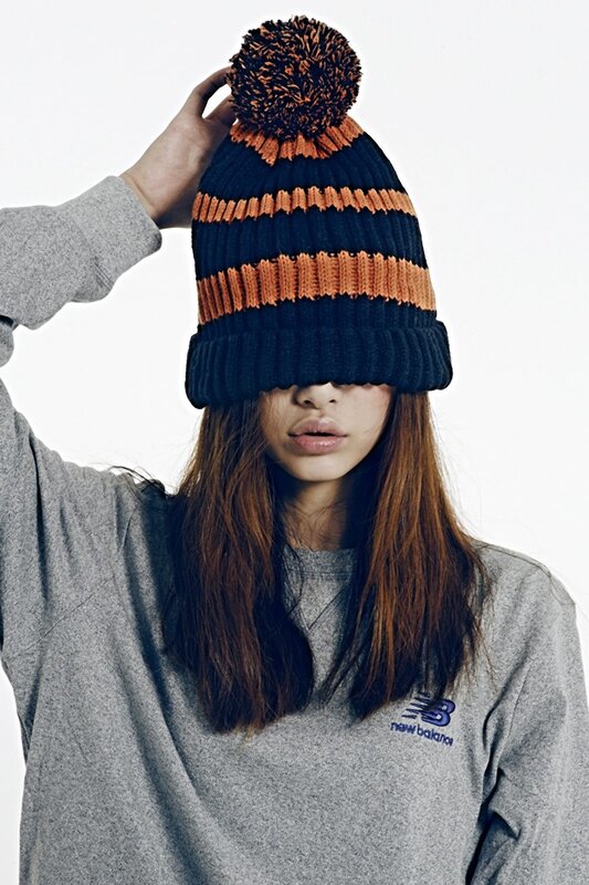 person wearing striped beanie