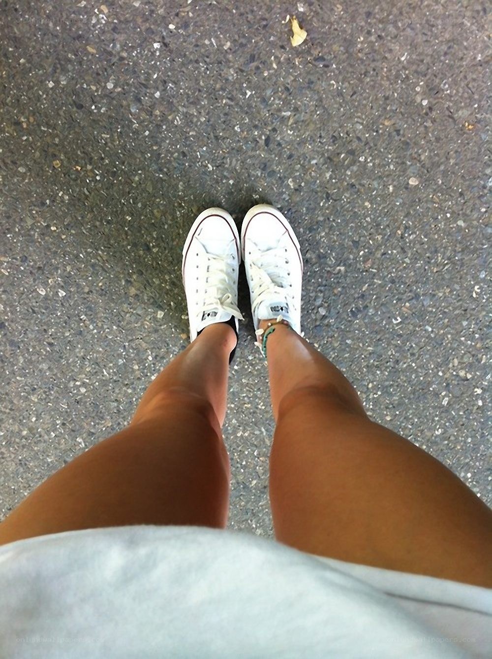 person wearing white sneakers