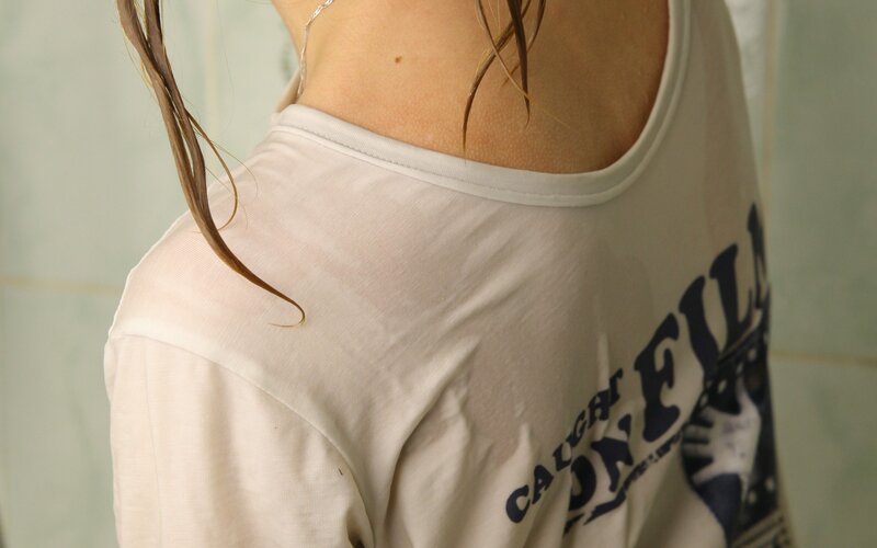 person wearing white t-shirt