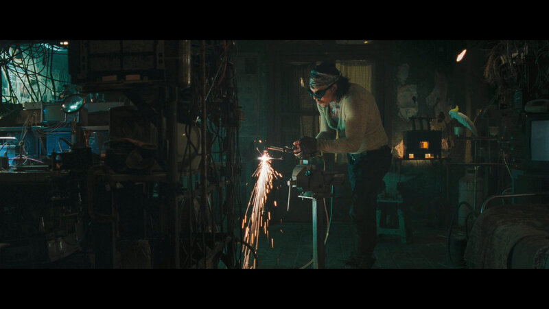 Person welding in workshop
