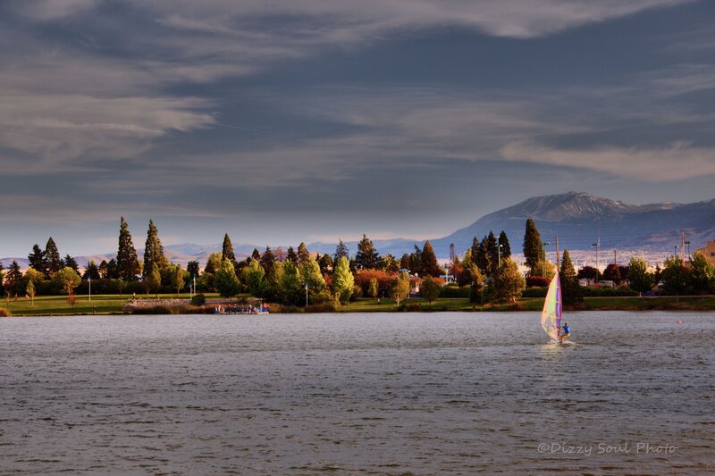 Person Windsurfing on Lake