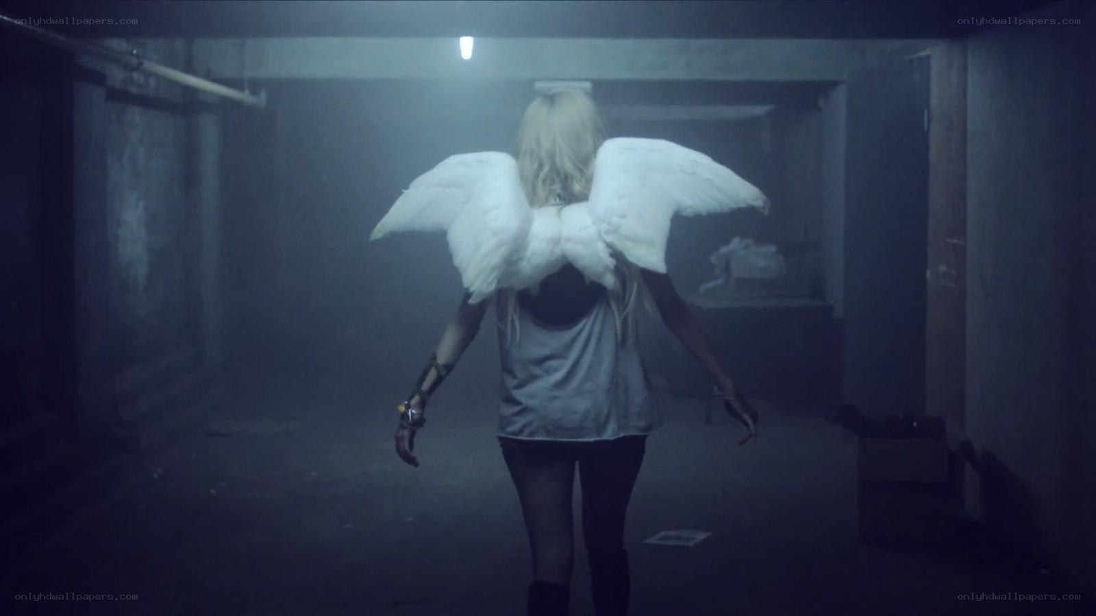 person with angel wings in basement