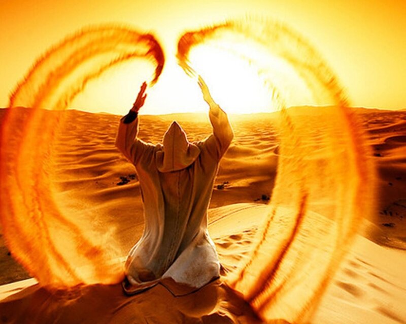 person with angel wings in desert