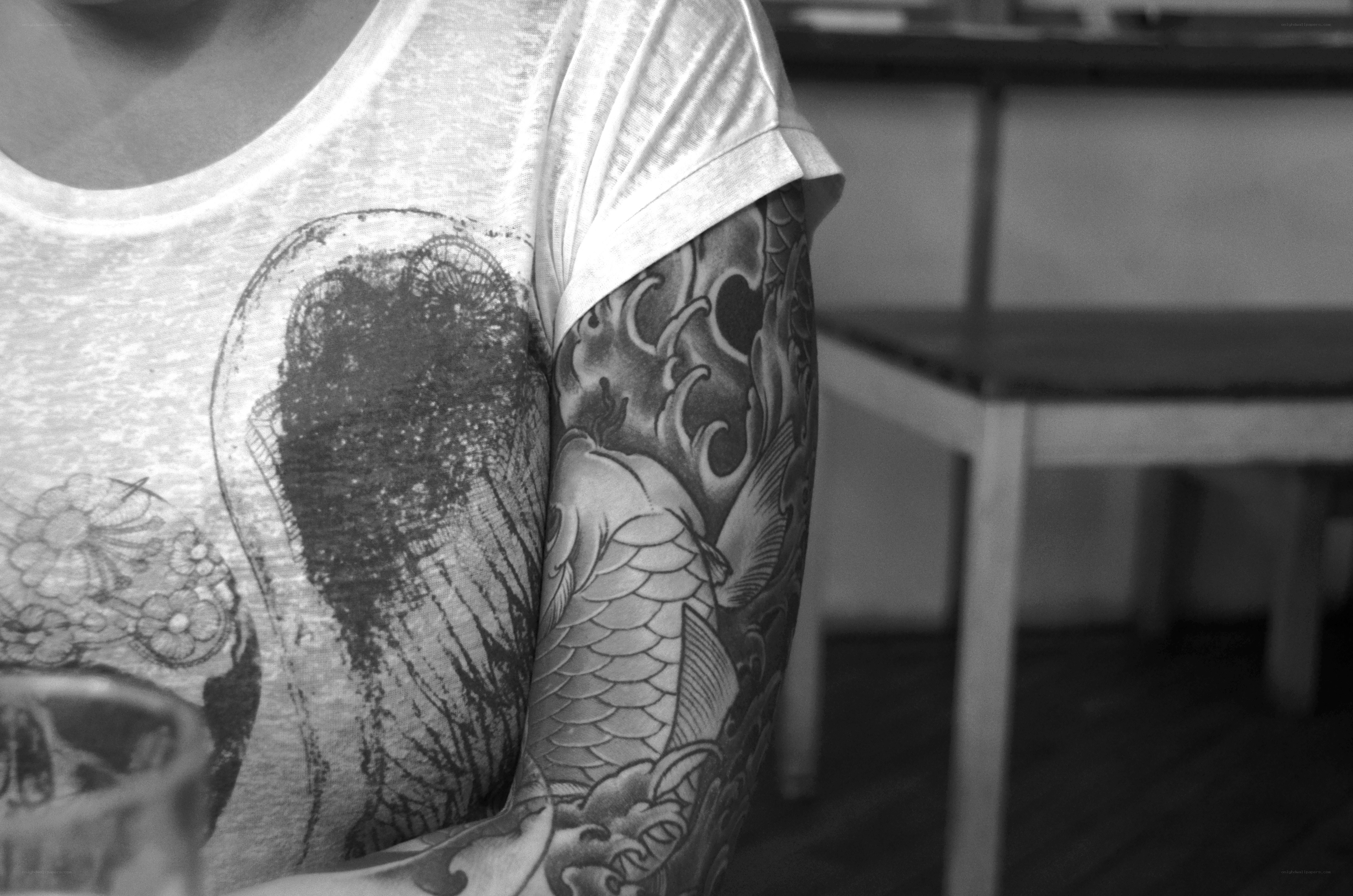 person with arm tattoo