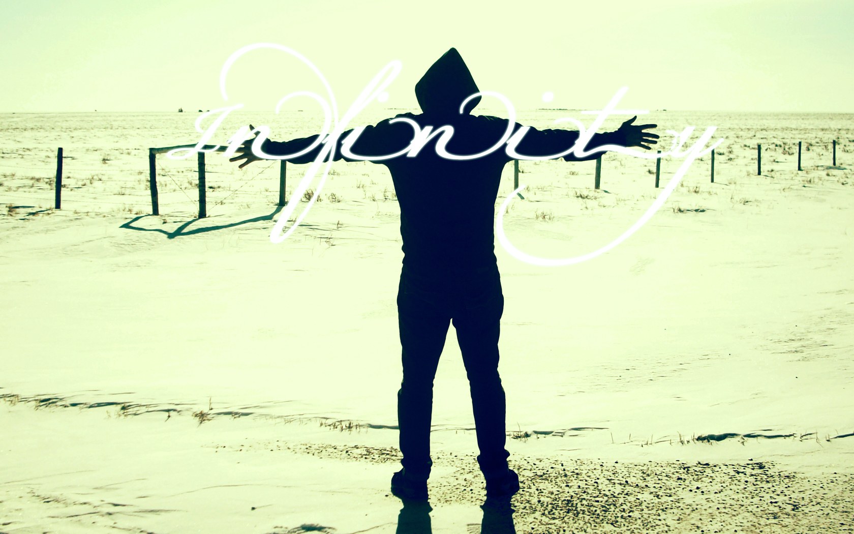person with arms outstretched in desert