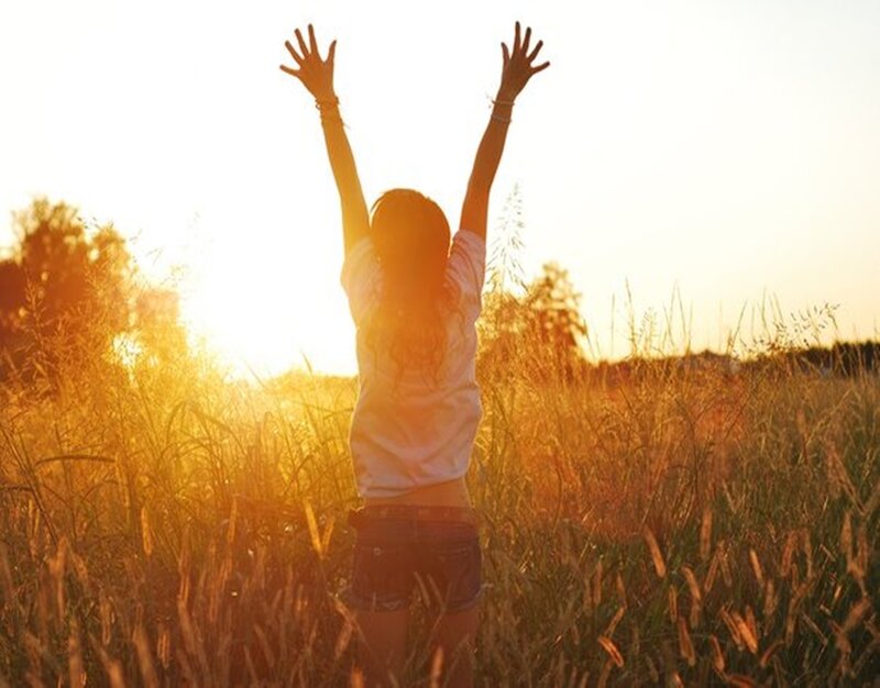 Person with Arms Raised — Gold