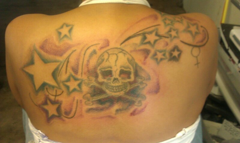 Person with Back Tattoo — Brown