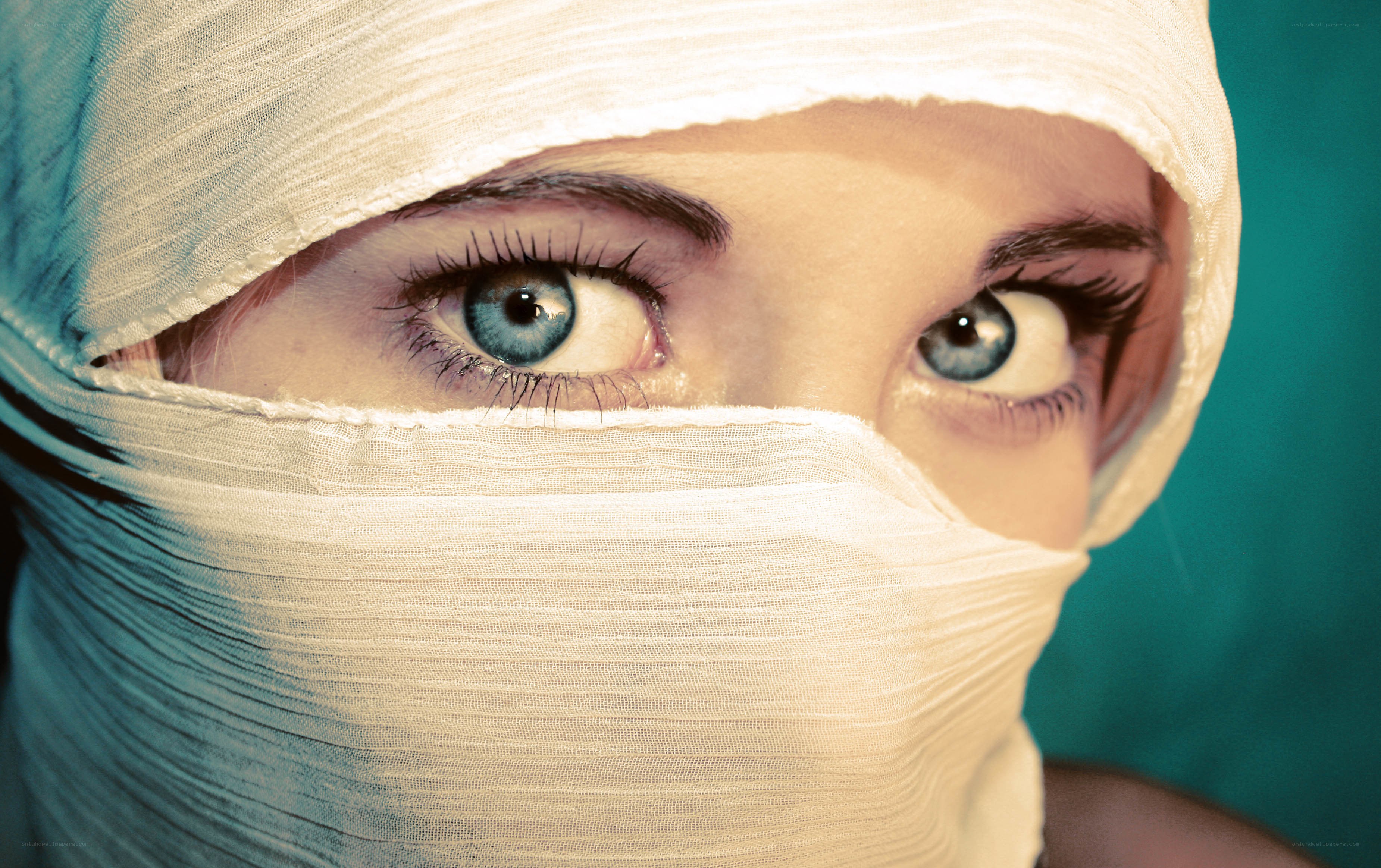 person with bandaged face