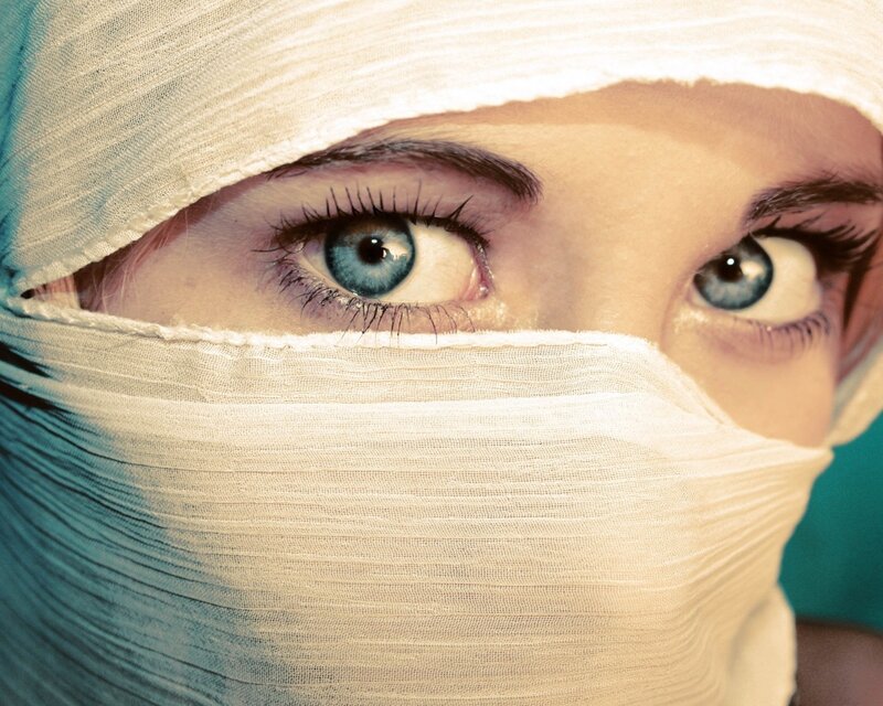 person with bandaged face