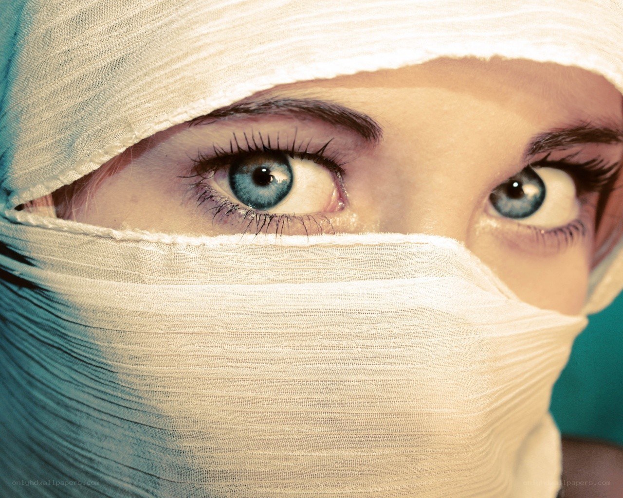 person with bandaged face