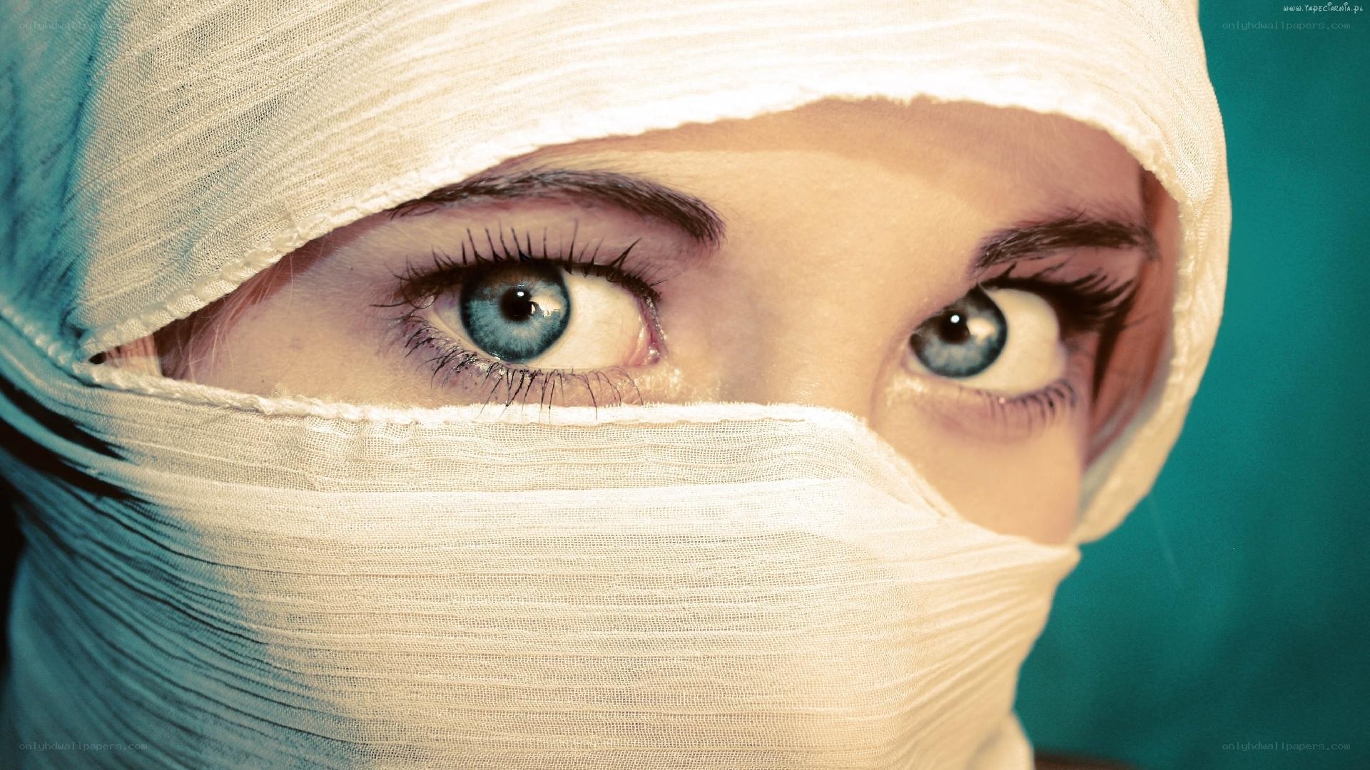 person with bandaged face