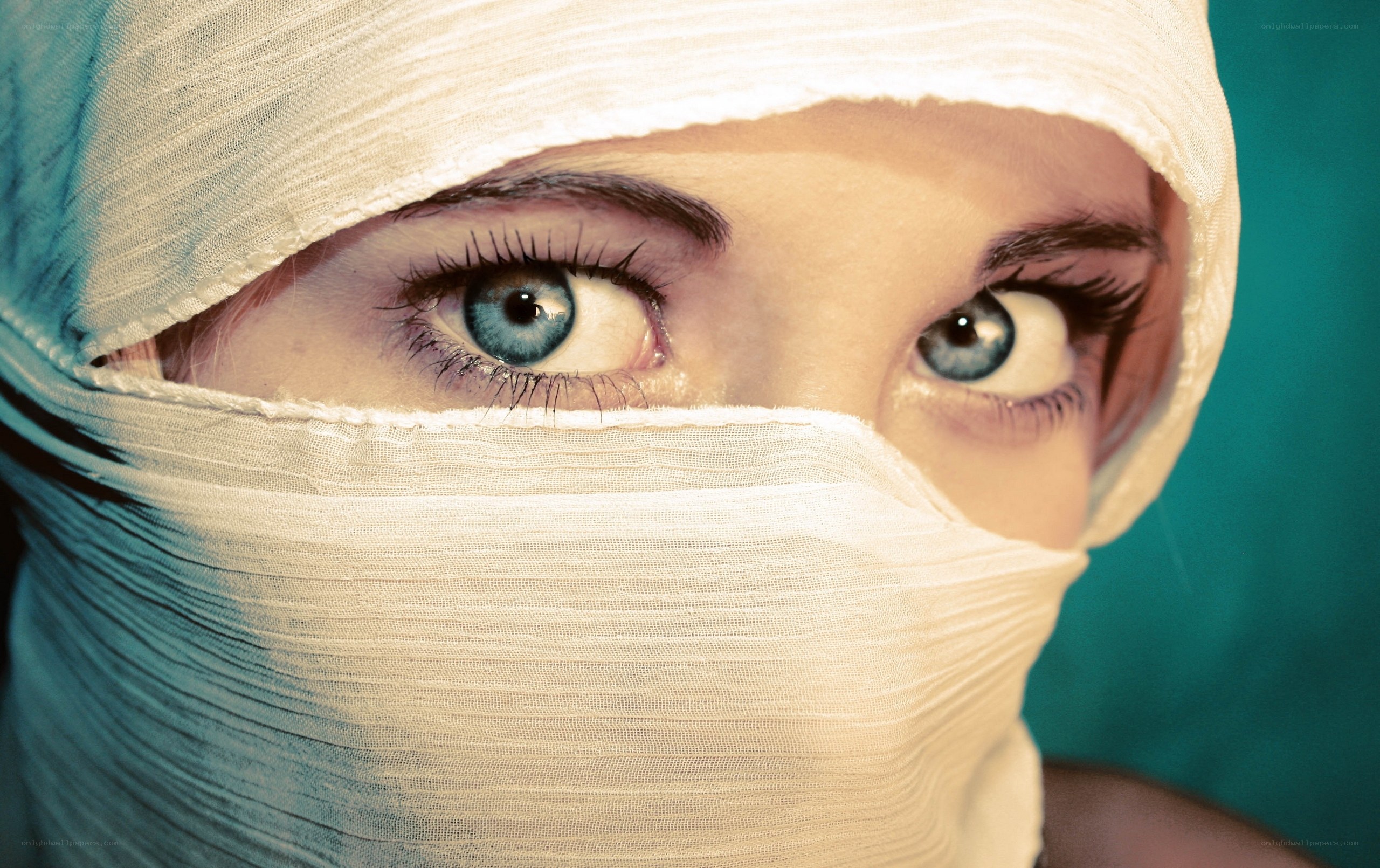 person with bandaged face