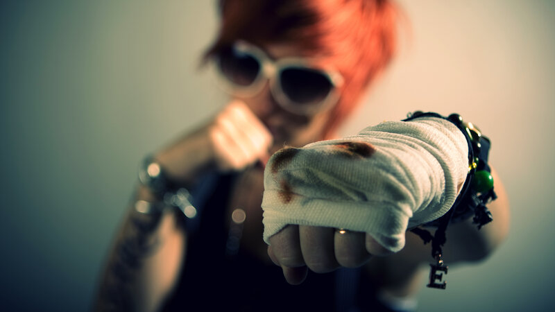person with bandaged fist