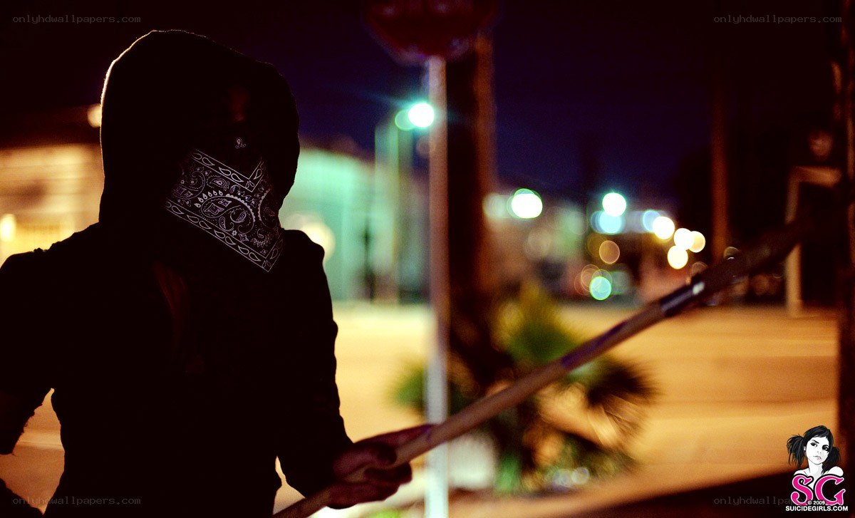 person with baton at night