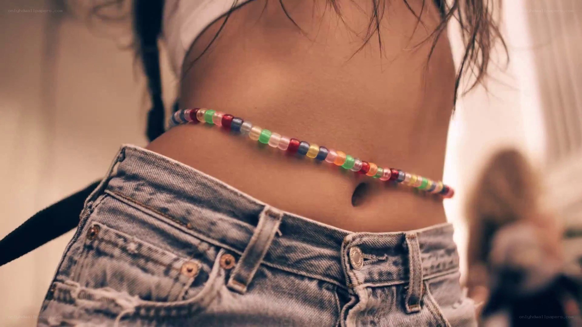 person with beaded belt