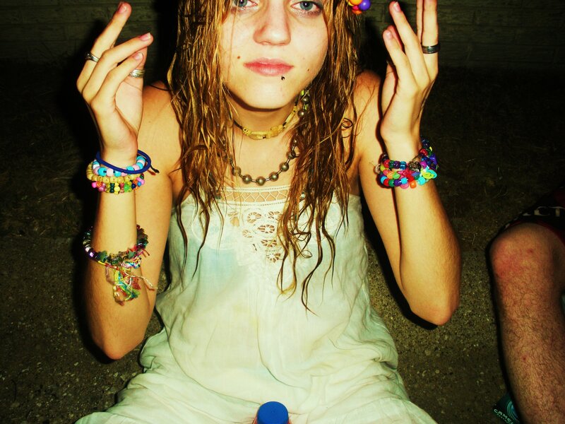 person with beaded bracelets