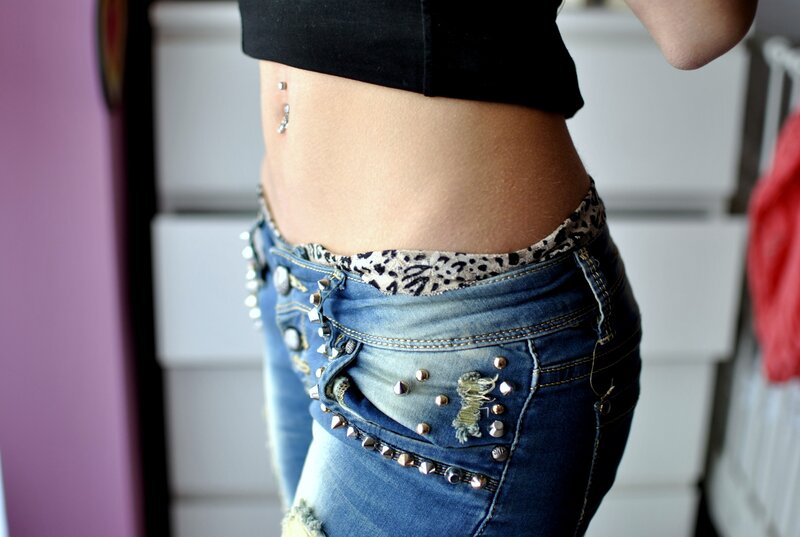 person with belly button piercing