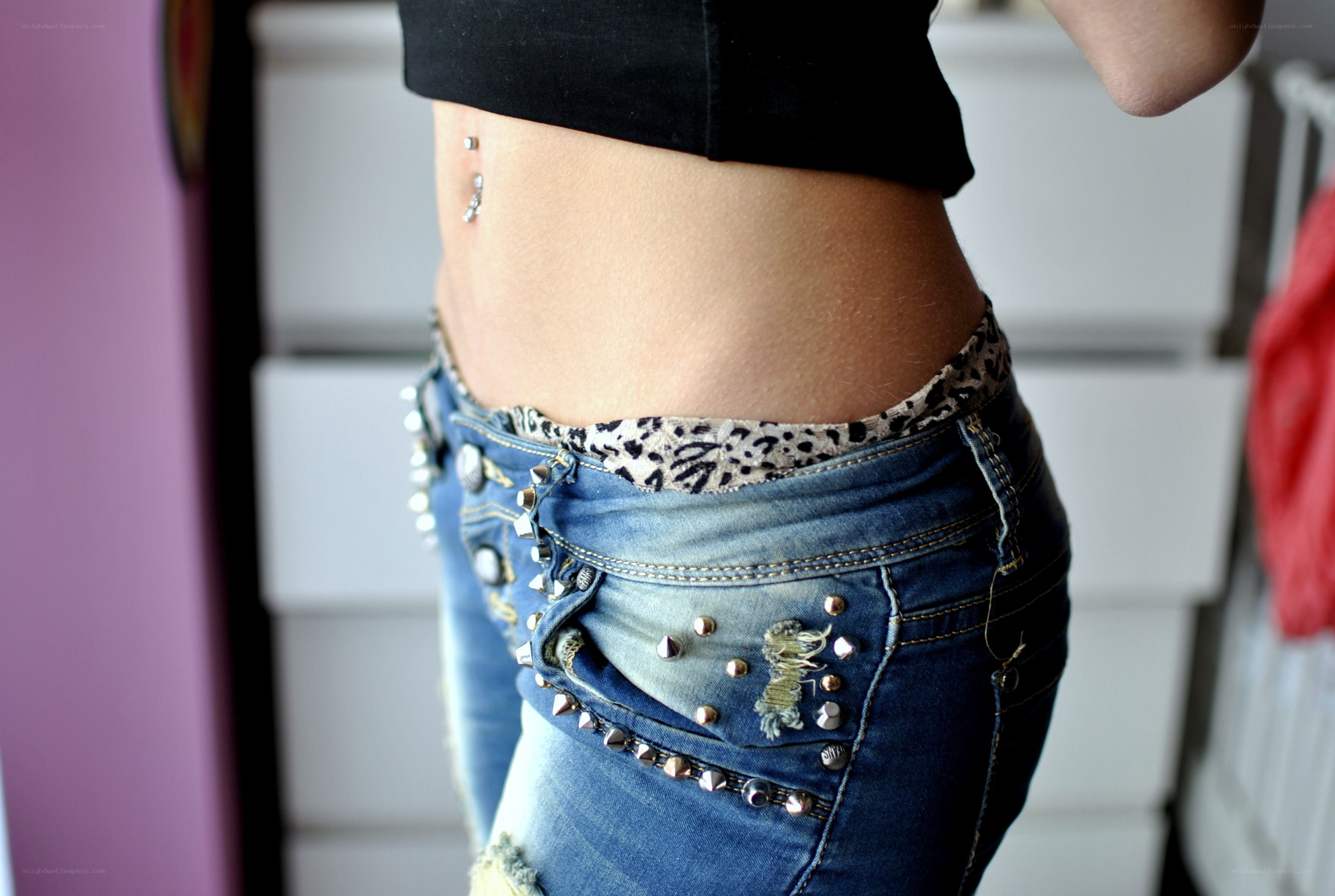 person with belly button piercing