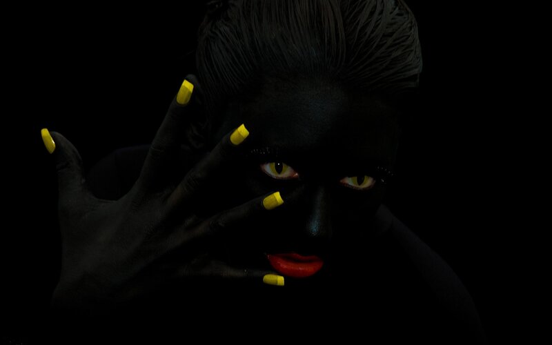 Person with Black Body Paint — Dramatic