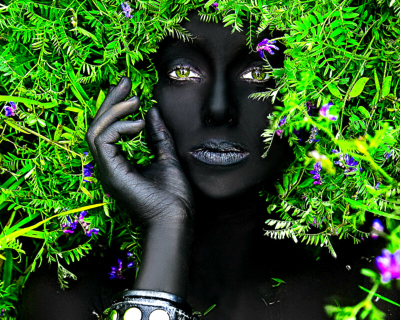 Person with Black Face Paint — Dramatic