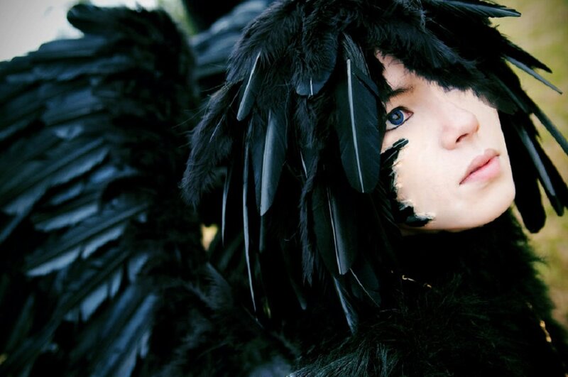 Person with Black Feathers