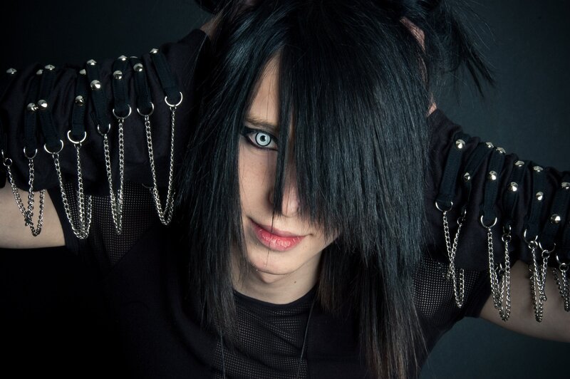 person with black hair and chains