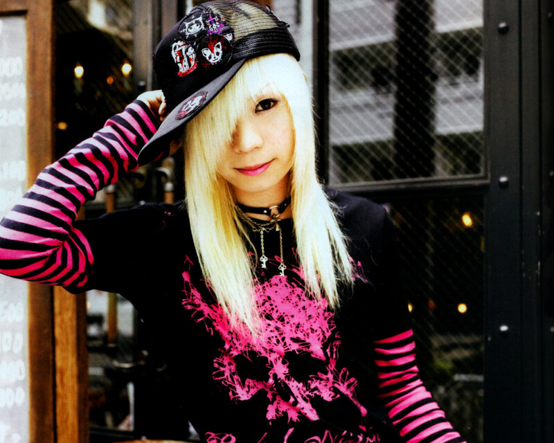 person with blonde hair and cap