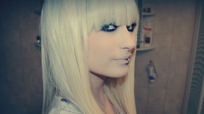person with blonde hair and makeup