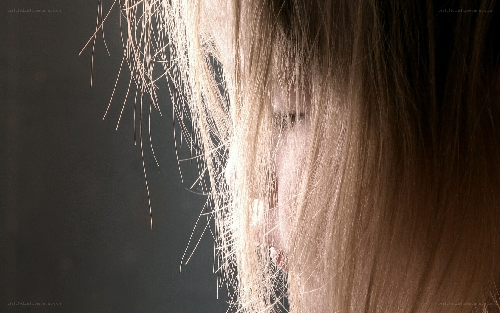 person with blonde hair in profile