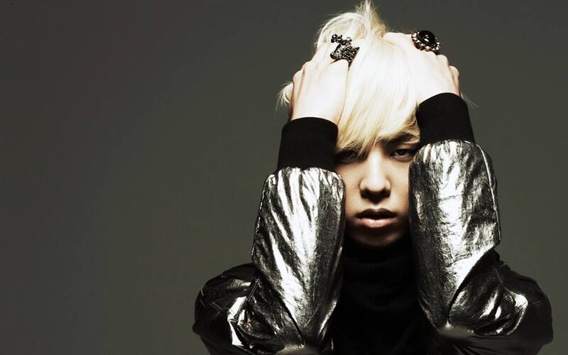 person with blonde hair in silver jacket