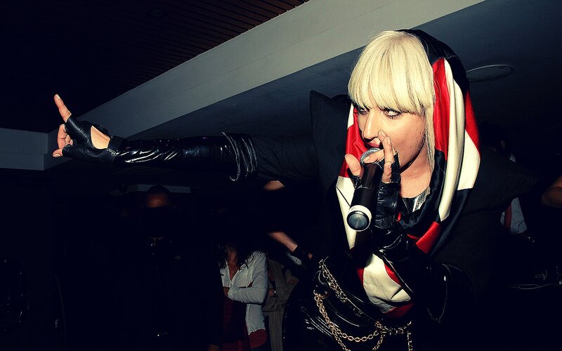 Person with Blonde Hair Singing — Black