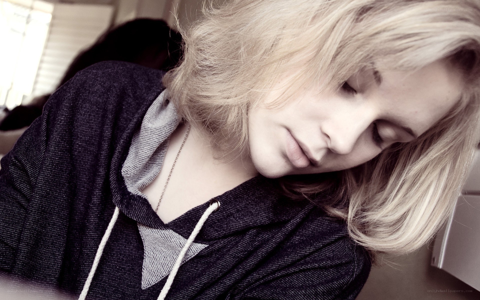 person with blonde hair sleeping