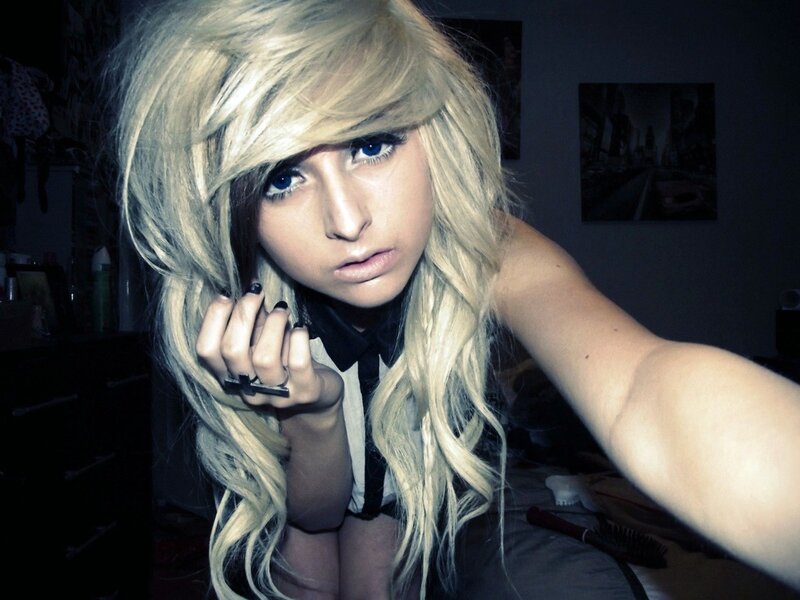 person with blonde hair taking selfie