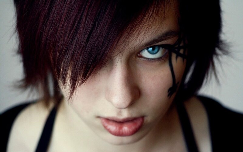 person with blue eyes and face paint