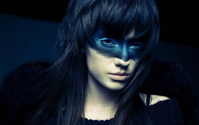 person with blue face paint