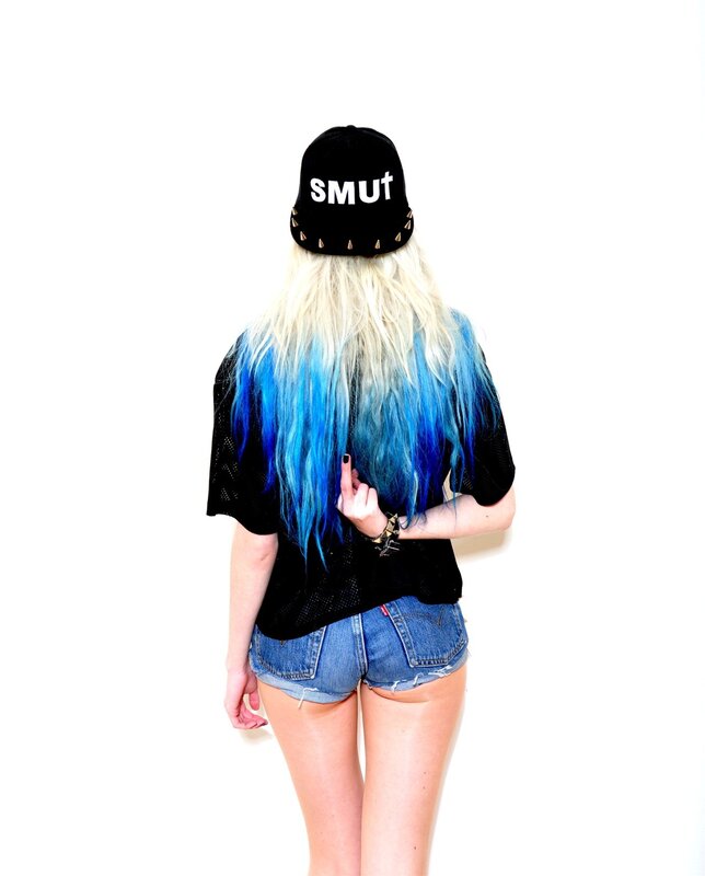 person with blue hair and cap