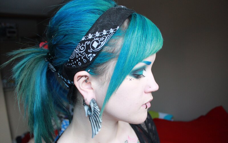 person with blue hair and makeup